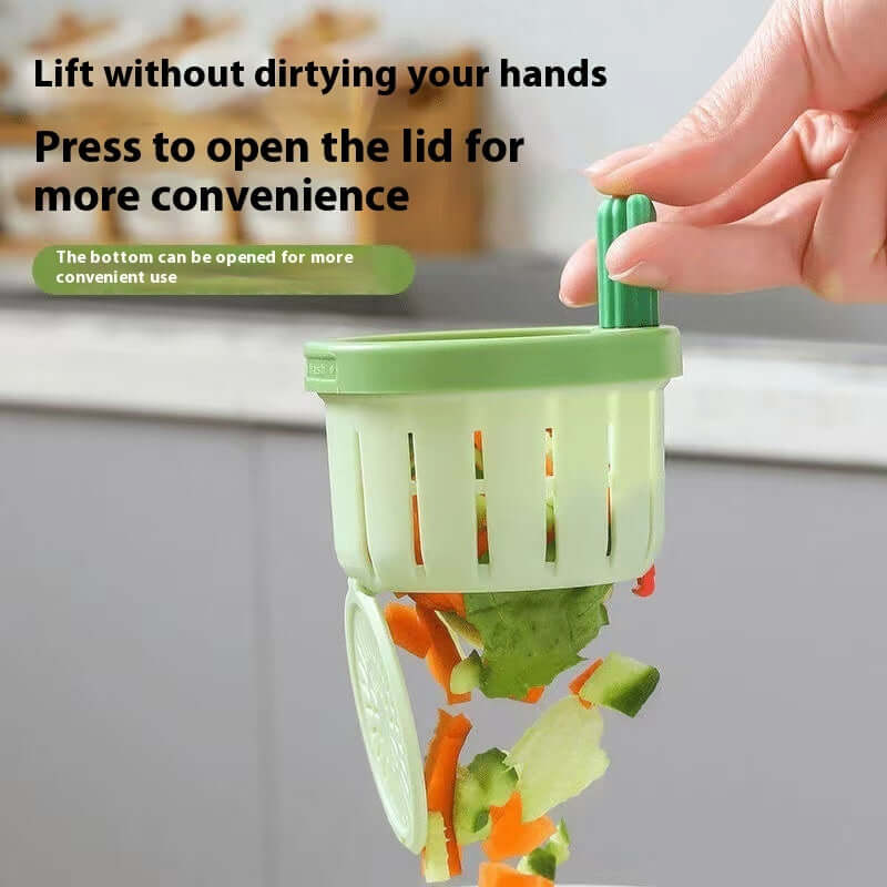 Hand using green kitchen gadget with lid to dispose of chopped vegetable scraps easily