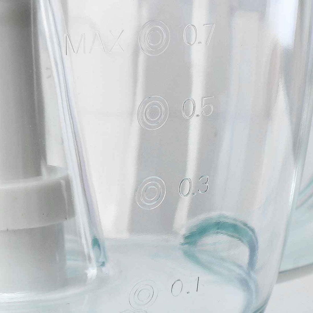 Close-up of blender jar with measurement markings in liters, kitchen appliance detail