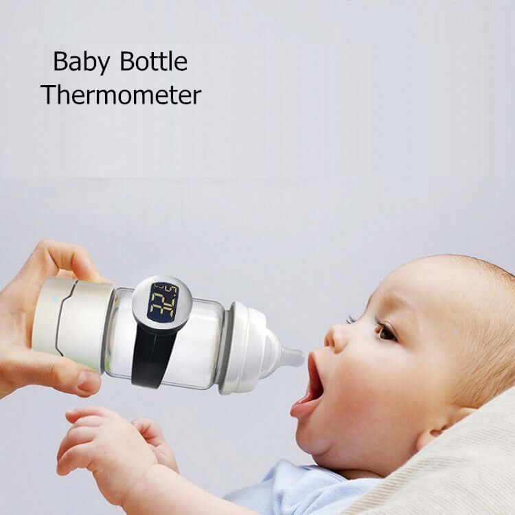 Baby drinking from bottle with digital thermometer, baby bottle temperature monitor