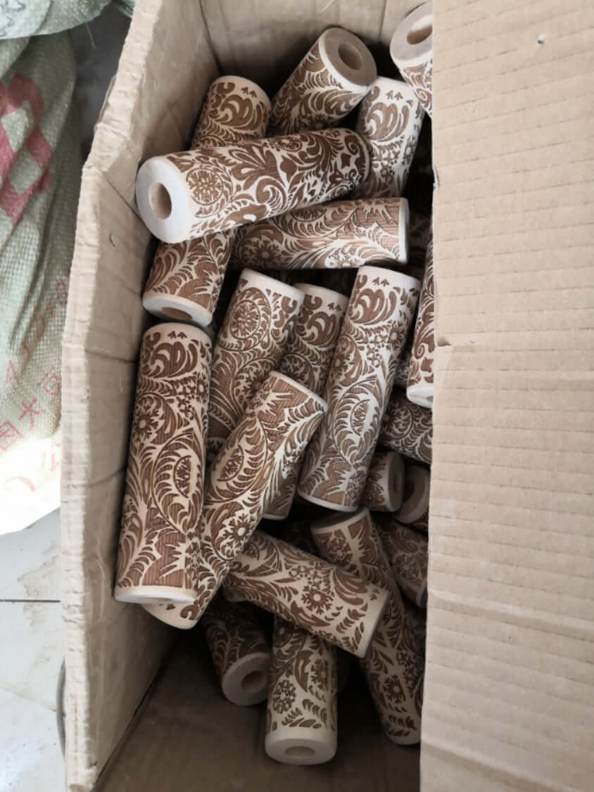 Box of decorative embossed kitchen roller stamps with floral patterns