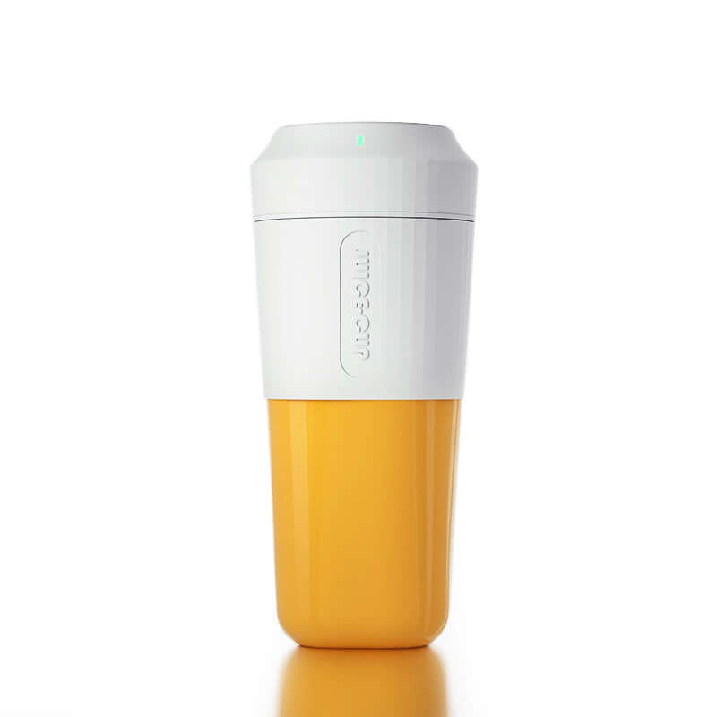 Yellow and white portable kitchen blender cup on a white background