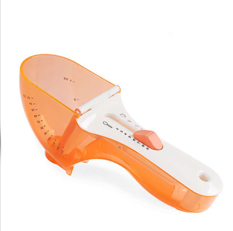 Adjustable orange plastic measuring scoop with white handle for kitchen use