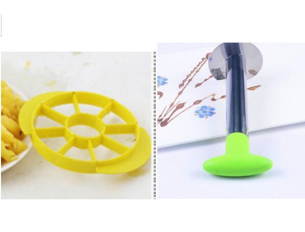 Yellow dough cutter and green-handled pizza slicer on kitchen counter