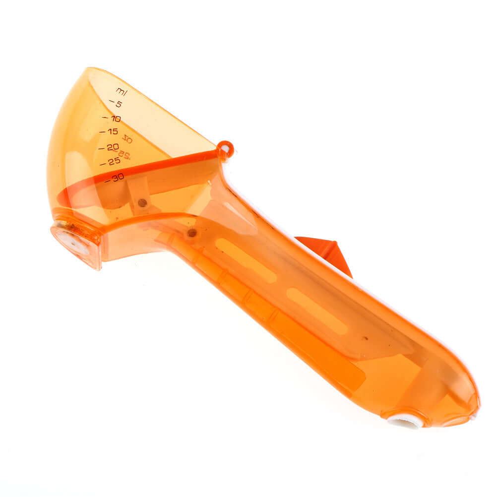 Orange plastic kitchen measuring tool with handle and milliliter markings