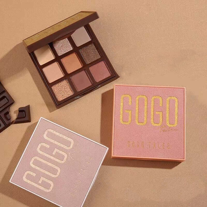 Eyeshadow palette with nine neutral shades, GOGO packaging, on a beige surface