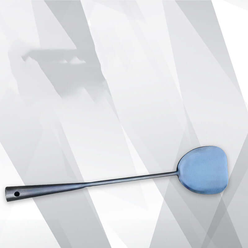 Stainless steel kitchen spatula with long handle on geometric background