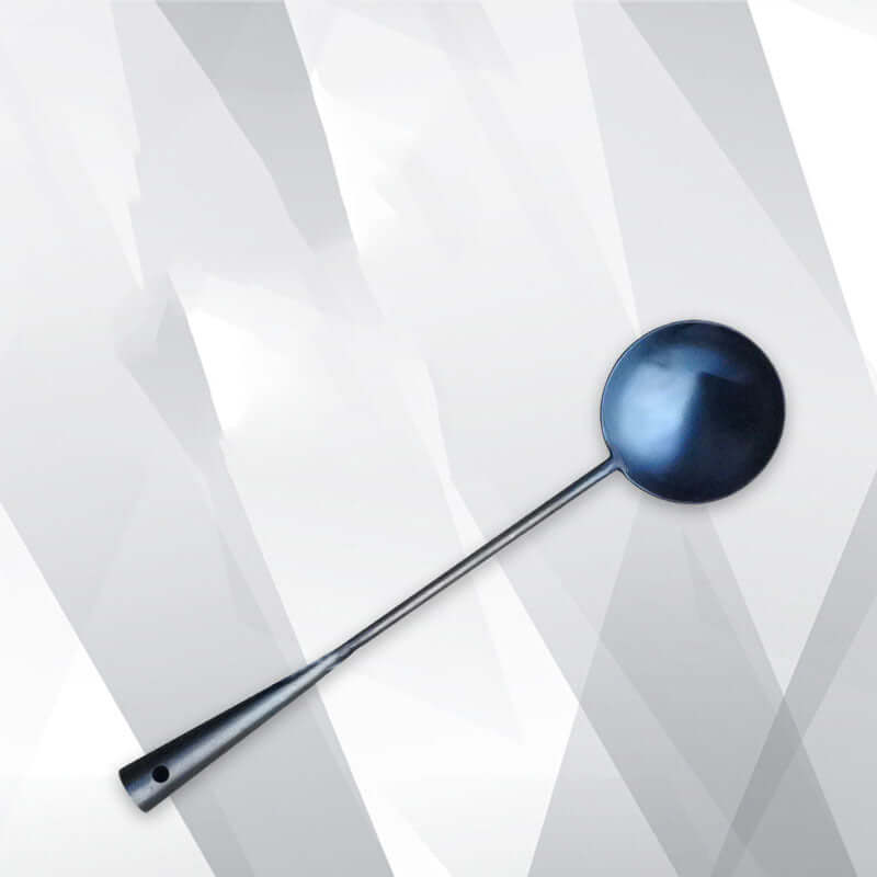 Stainless steel kitchen ladle with long handle on a geometric white background