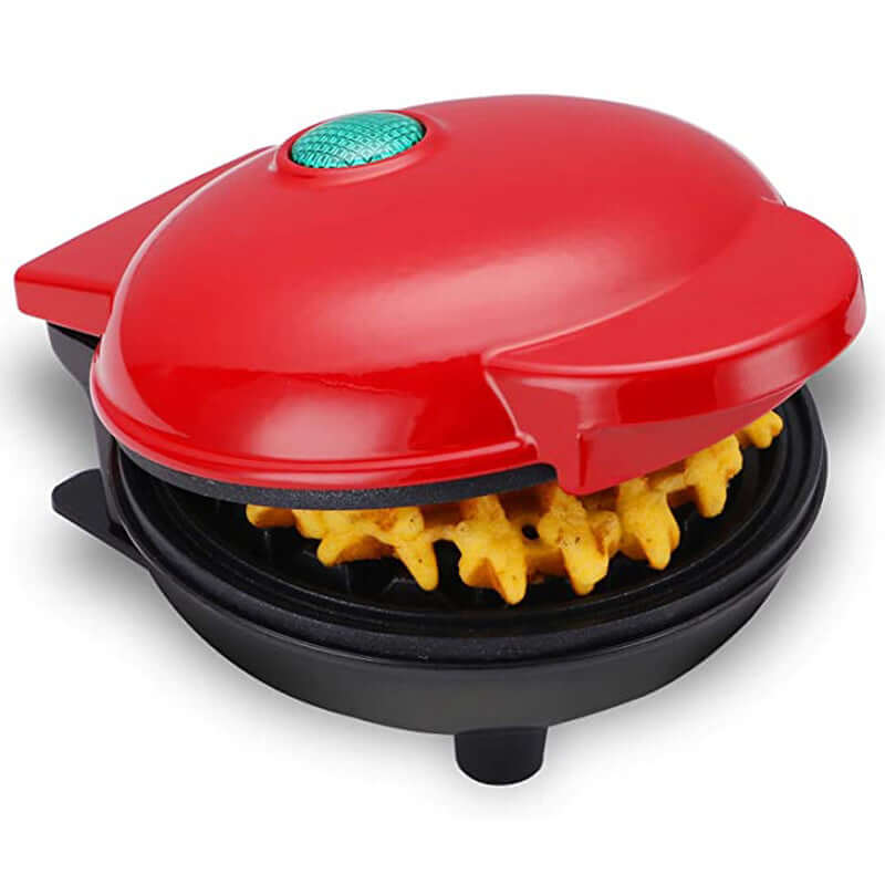 Compact red waffle maker appliance cooking a golden waffle, kitchen countertop view