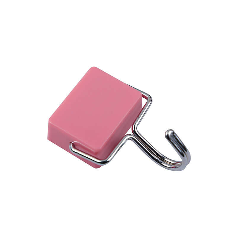 Pink square kitchen wall hook with metal arm for hanging utensils