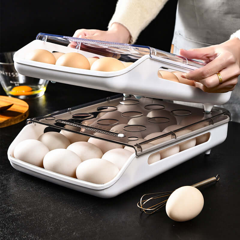 Stackable plastic egg storage container filled with eggs on kitchen counter