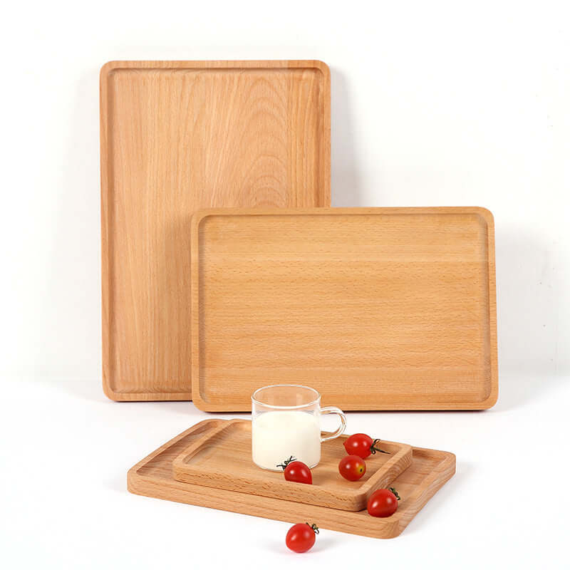 Set of rectangular wooden kitchen trays with a glass of milk and cherry tomatoes