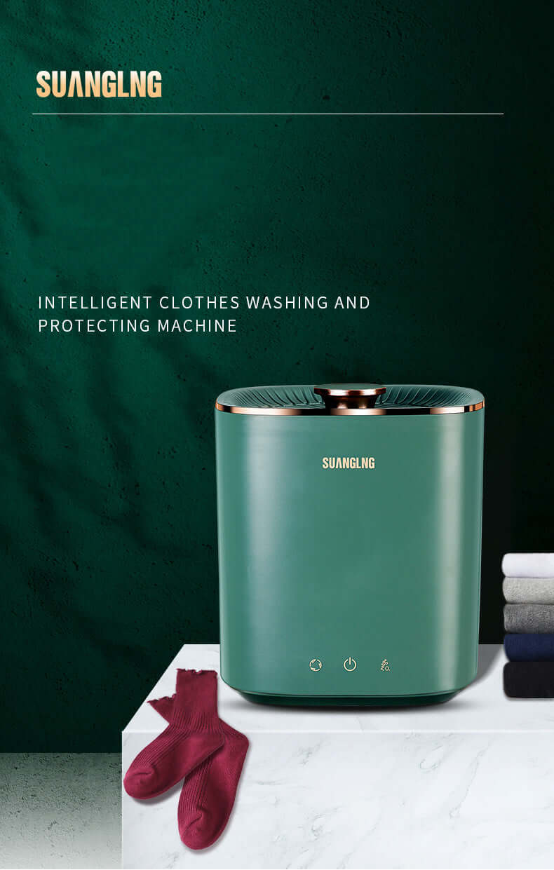 Green compact clothes washing machine with control icons, folded towels, and red socks nearby