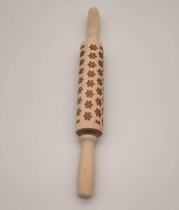 Wooden embossed rolling pin with floral pattern for baking cookies or pastries