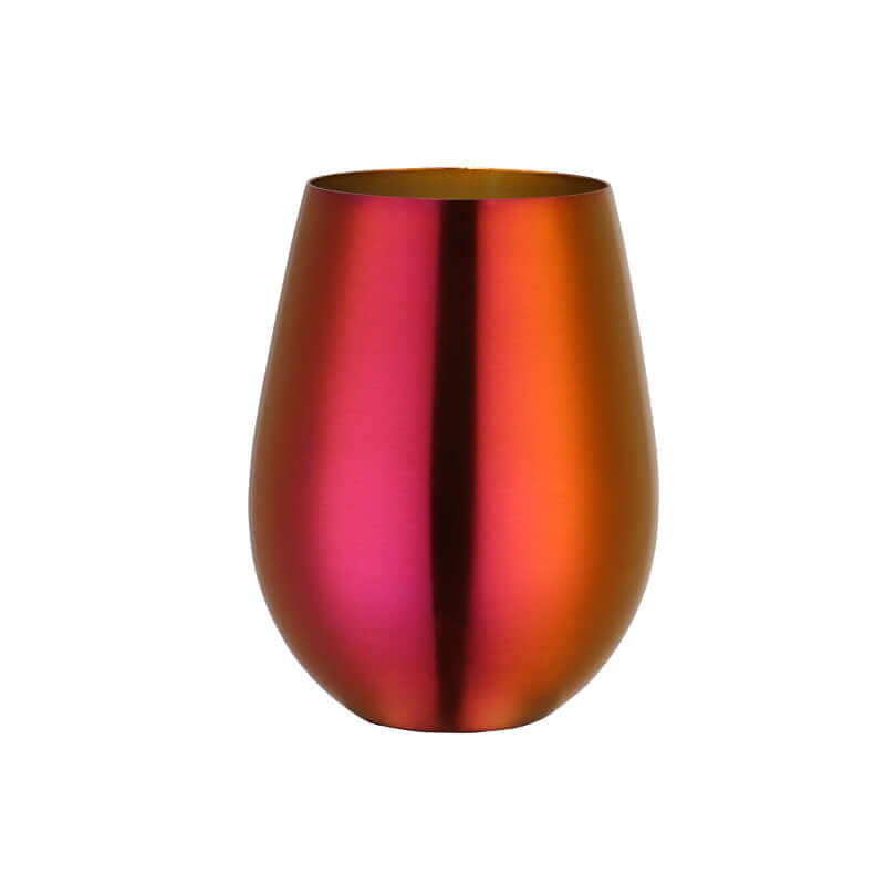 Metallic ombre stemless wine glass in red orange gradient on white background