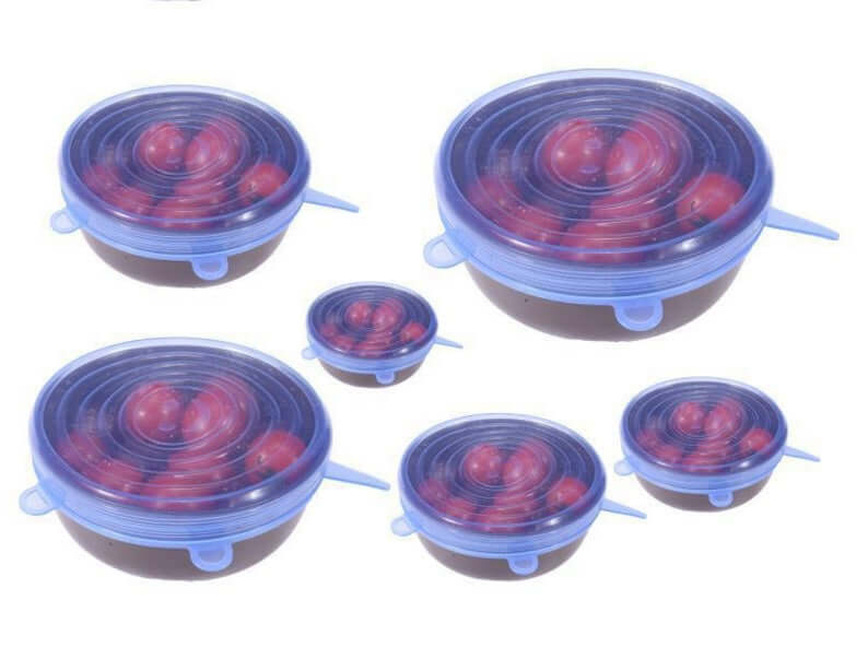 Set of reusable silicone stretch lids covering bowls of tomatoes, kitchen storage solution