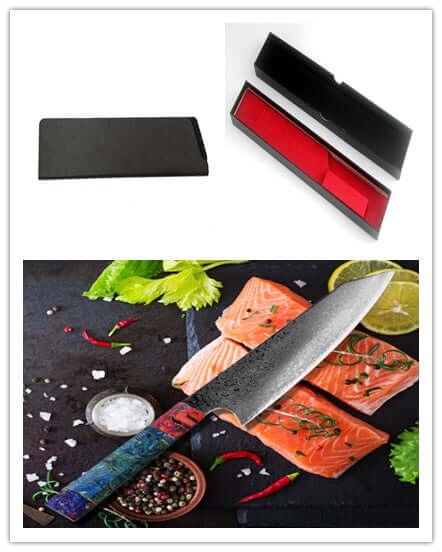 Chef knife with patterned blade and colorful handle, boxed, beside raw salmon and spices