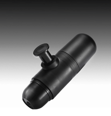 Black handheld manual coffee grinder on a gradient background