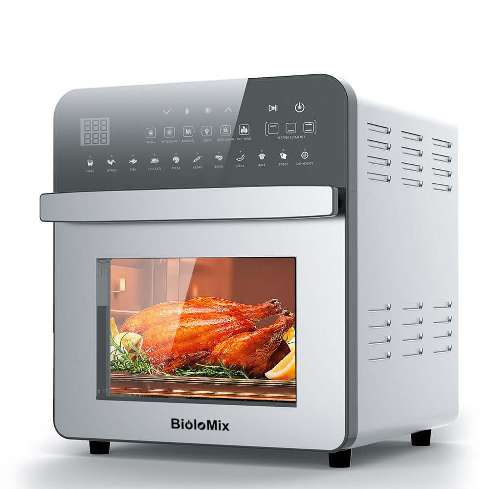 Countertop air fryer oven with digital display cooking a roasted chicken