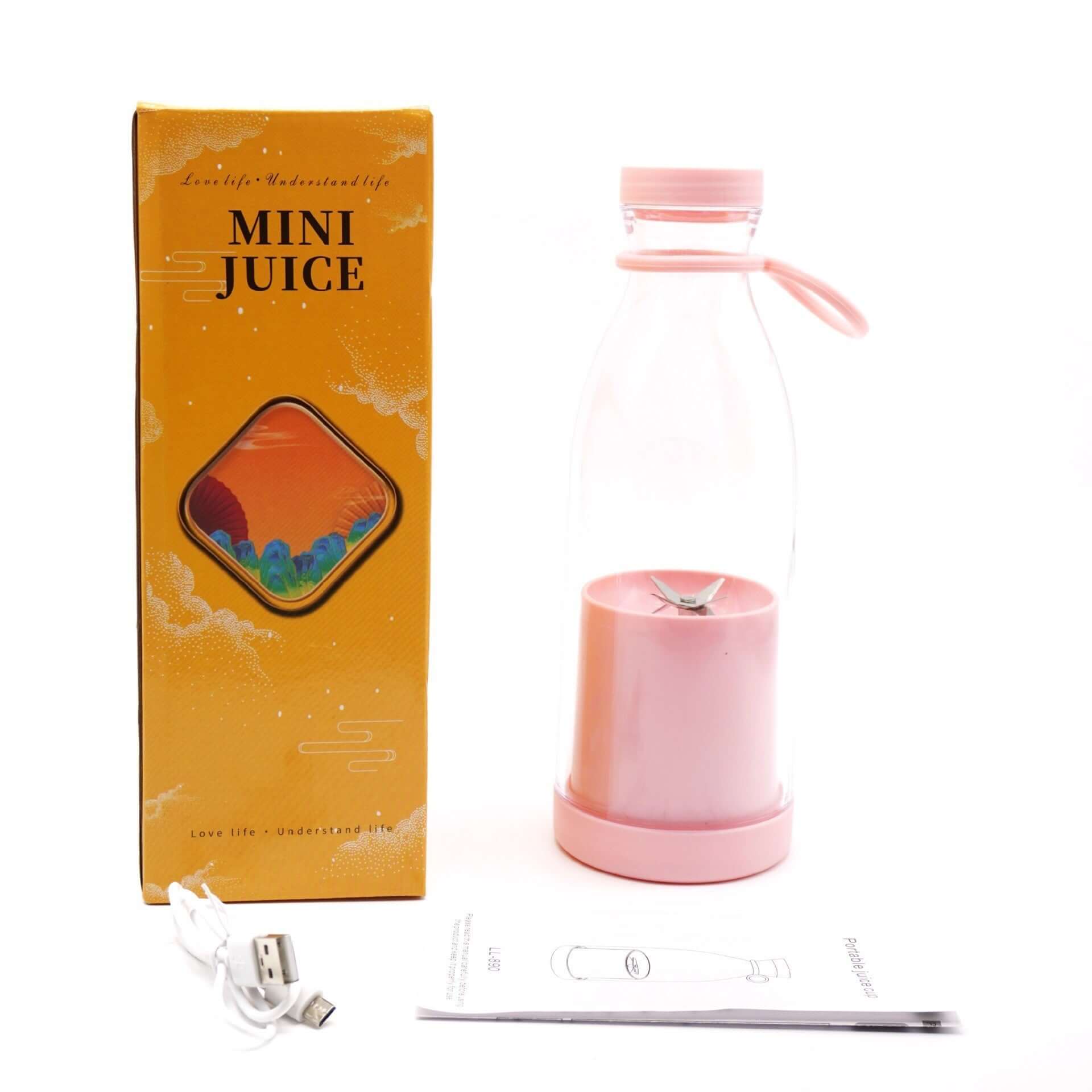 Pink portable mini juice blender with box, USB charging cable, and manual on white background