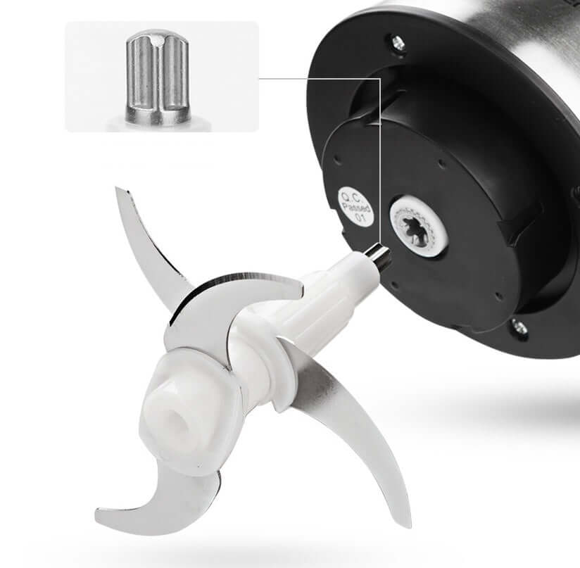 Stainless steel food processor blade attachment with closeup of metal connector for kitchen appliance