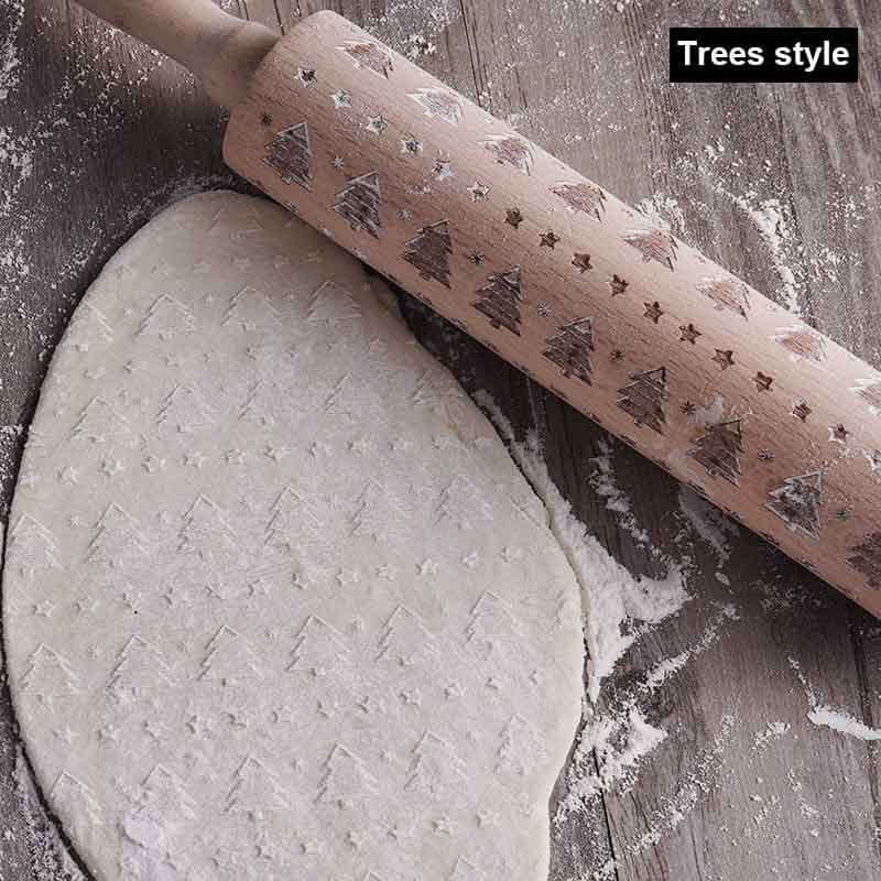 Wooden embossed rolling pin with Christmas tree pattern decorating cookie dough