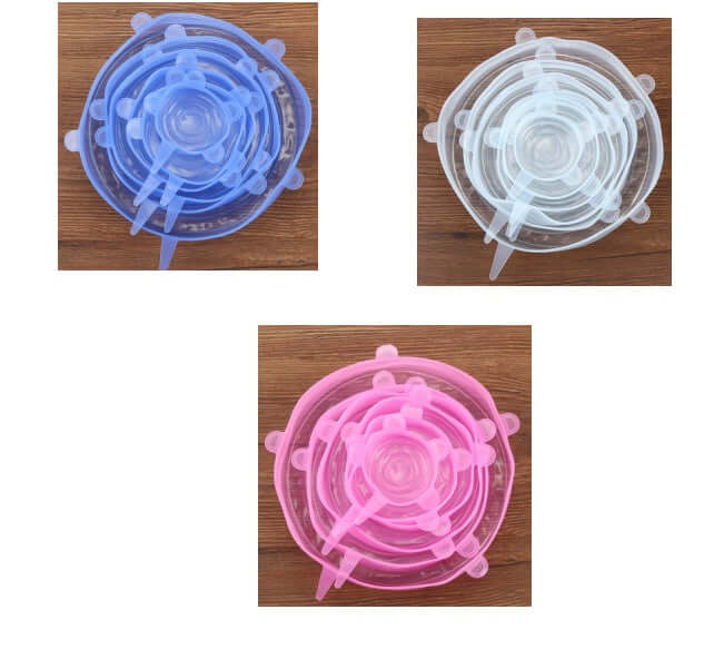 Assorted silicone stretch lids in blue, white, and pink on wooden surface, kitchen accessory