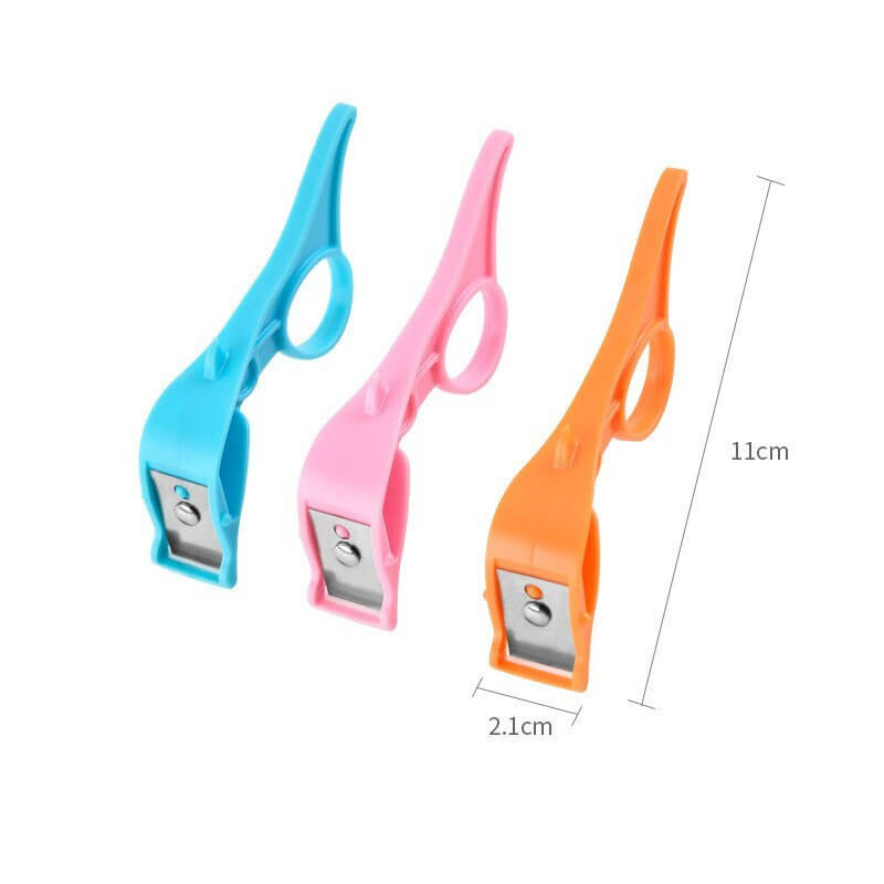 Three colorful plastic kitchen peelers with ergonomic handles, blue, pink, and orange, 11cm long