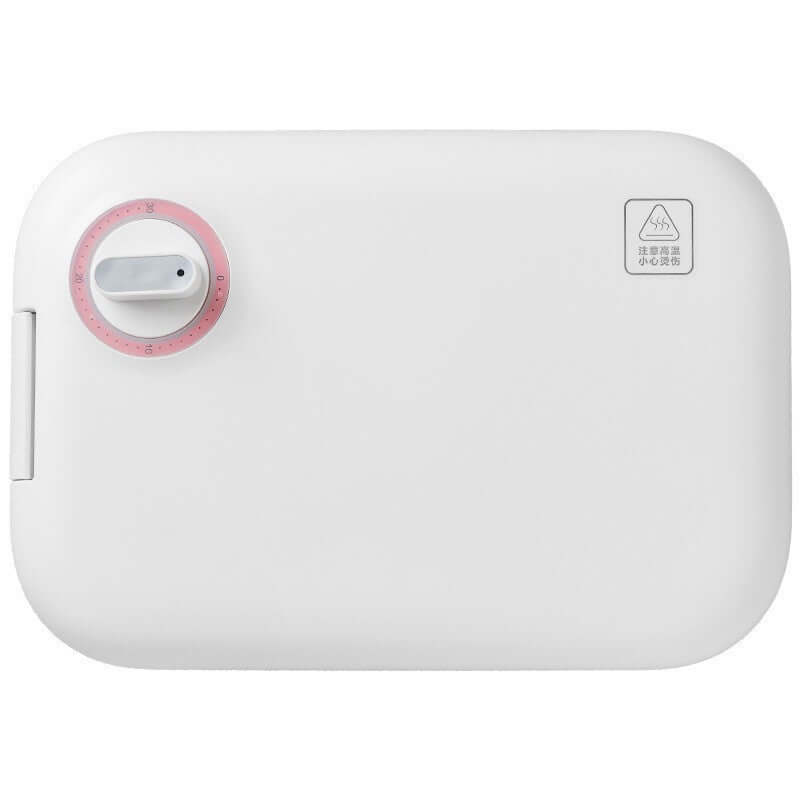 White kitchen appliance with a pink dial and warning symbol, countertop food steamer or sterilizer.