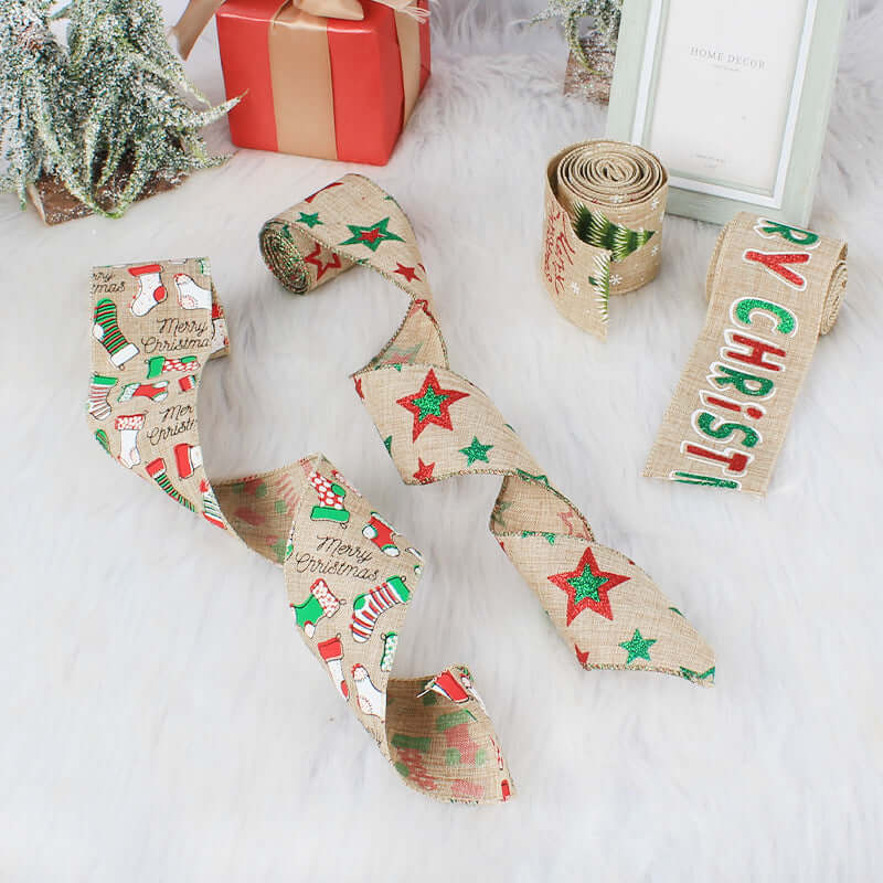 Christmas-themed burlap ribbons with festive designs and text on a white surface.