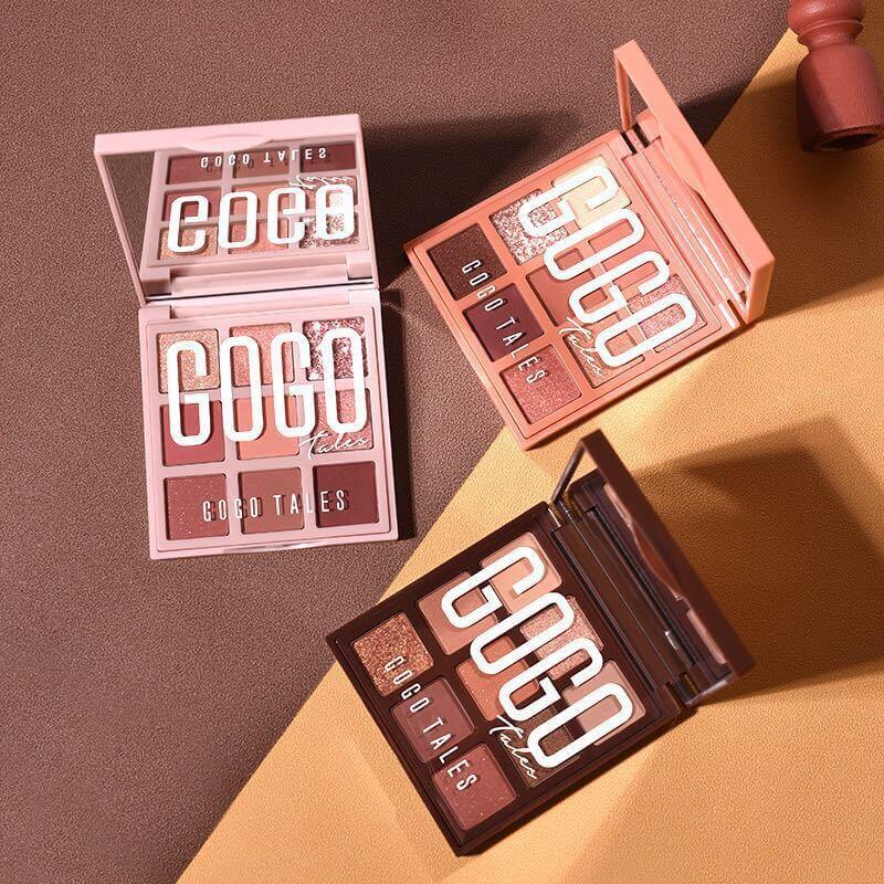 Three GOGO TALES eyeshadow palettes with neutral and shimmer shades on a brown background