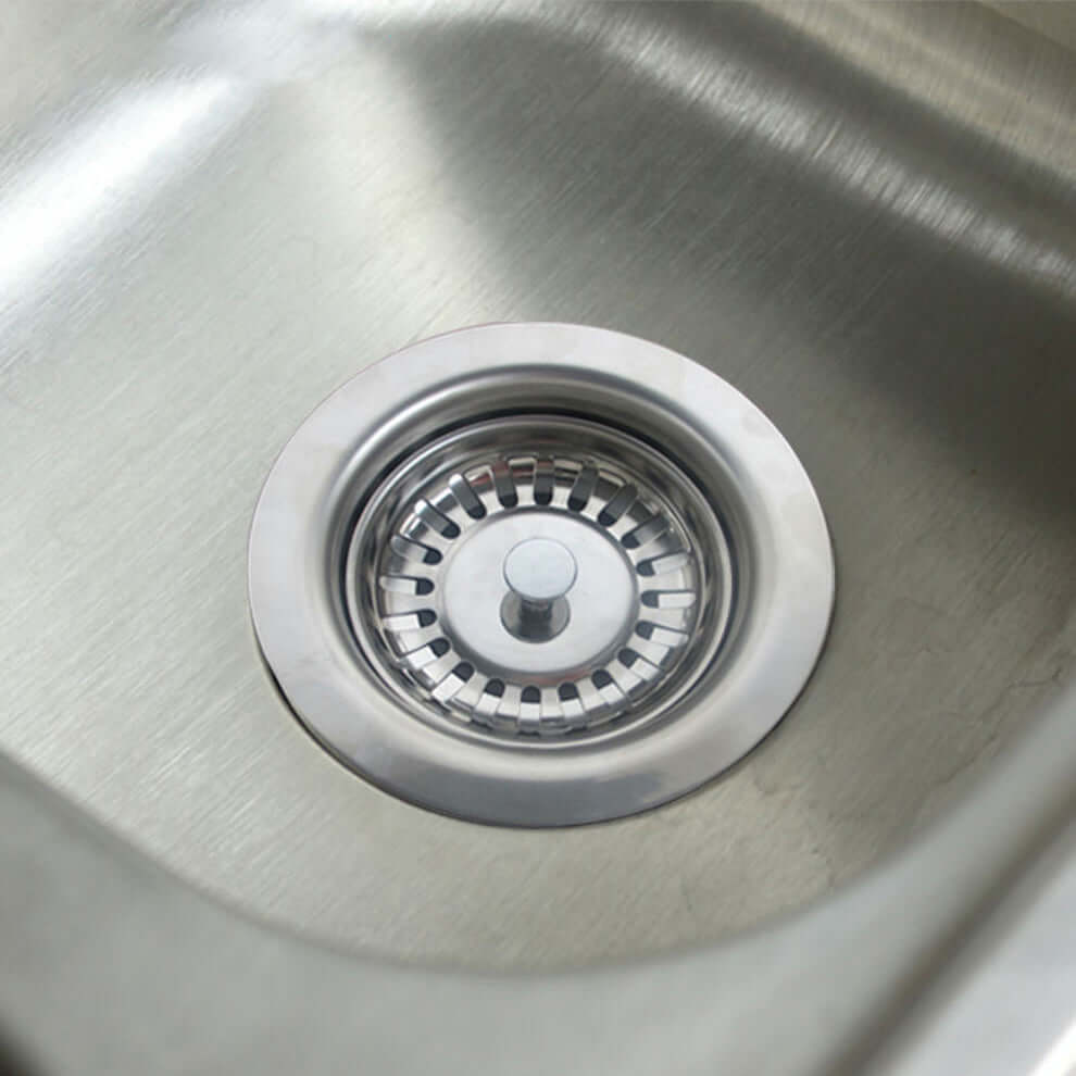 Stainless steel kitchen sink with a metal drain strainer basket insert
