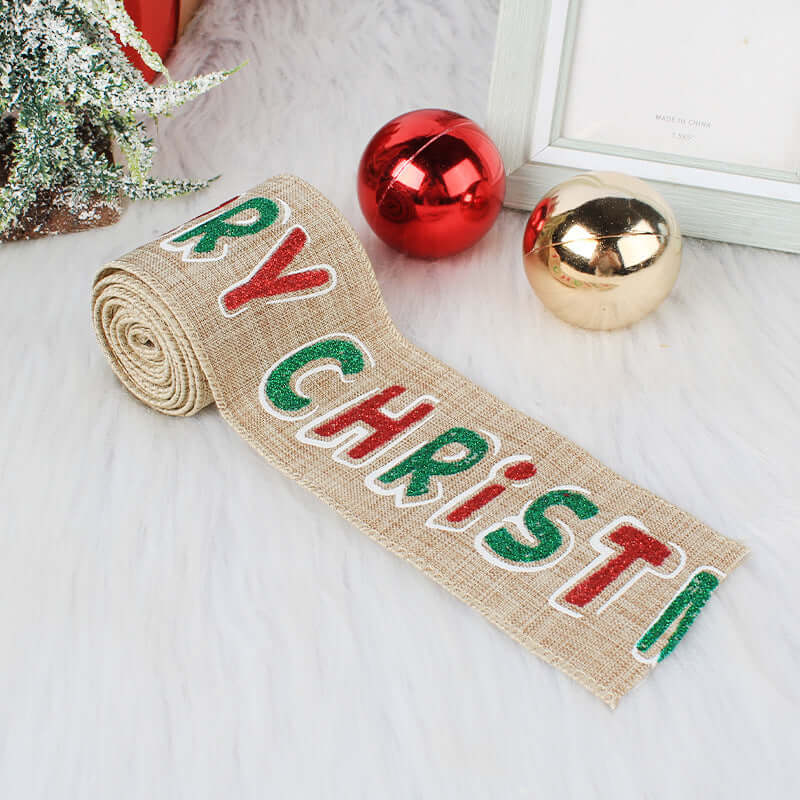 Burlap Merry Christmas ribbon with red and green letters, Christmas ornaments, festive decor