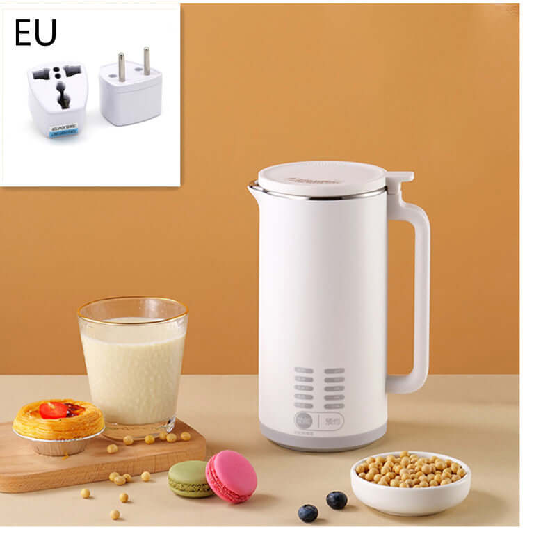 White electric soy milk maker with EU plug, soybean ingredients, pastries, and glass of soy milk