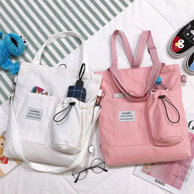 White and pink canvas tote bags with front pockets, umbrella holder, and fashion accessories
