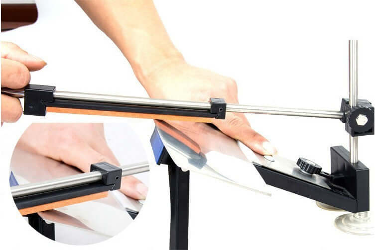 Manual kitchen knife sharpener with adjustable angle, person sharpening knife blade