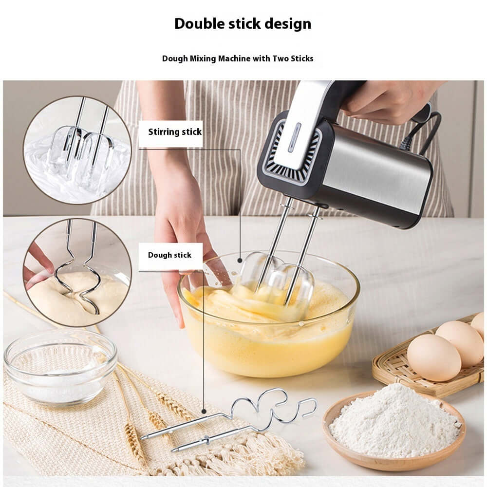 Hand mixer with double beater attachments mixing dough in a glass bowl, eggs and flour nearby.