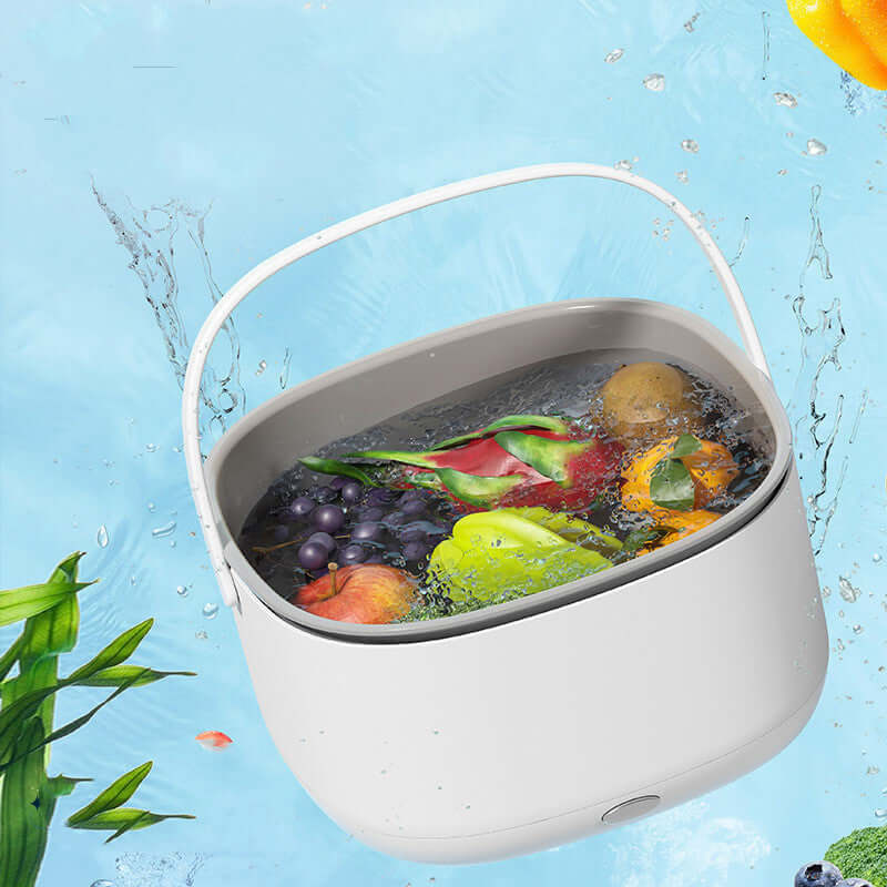 White kitchen wash basin with mixed fruits and vegetables soaking in water