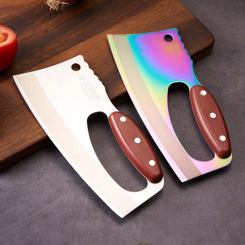 Two cleaver knives with wooden handles, one stainless steel and one rainbow finish, on a kitchen counter