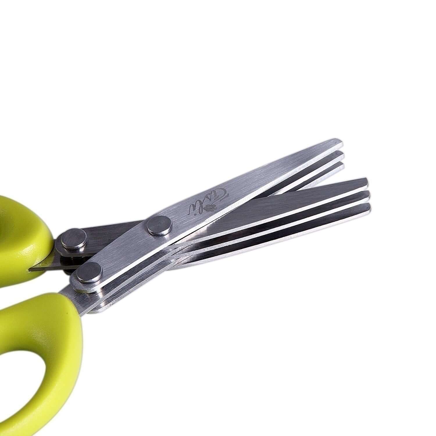 Multi-blade herb scissors with green handle for kitchen use on white background