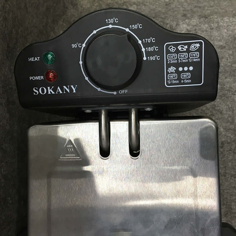 Electric deep fryer with temperature control knob and indicator lights for kitchen use