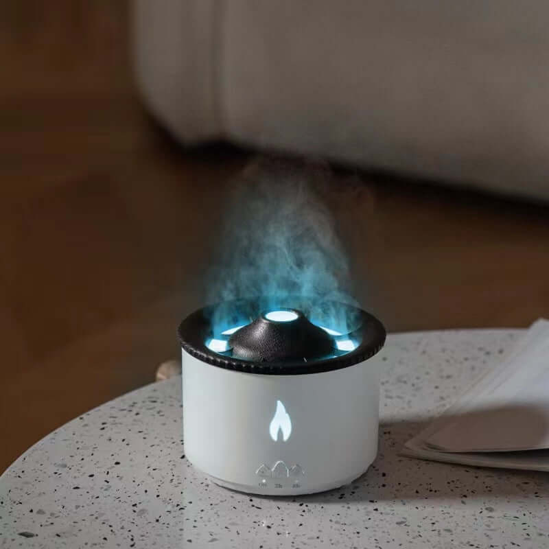 Modern tabletop aroma diffuser humidifier emitting vapor with LED light in a kitchen setting