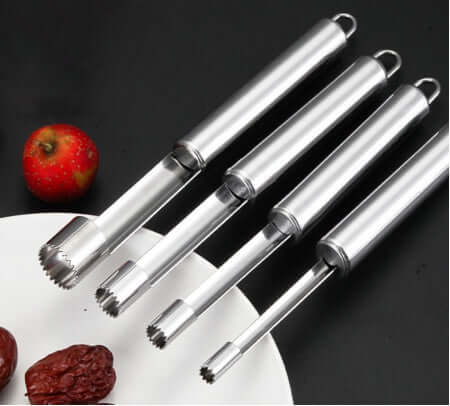 Stainless steel fruit corers on plate, ideal kitchen tool for apples and dates