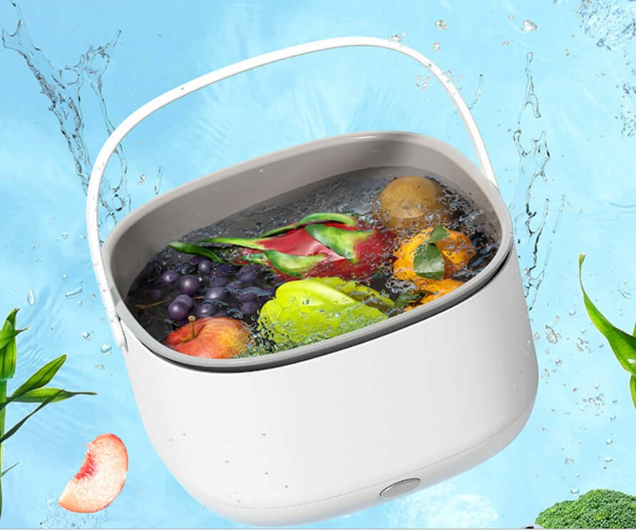 Portable white kitchen wash basin filled with fresh fruits and vegetables in water splash