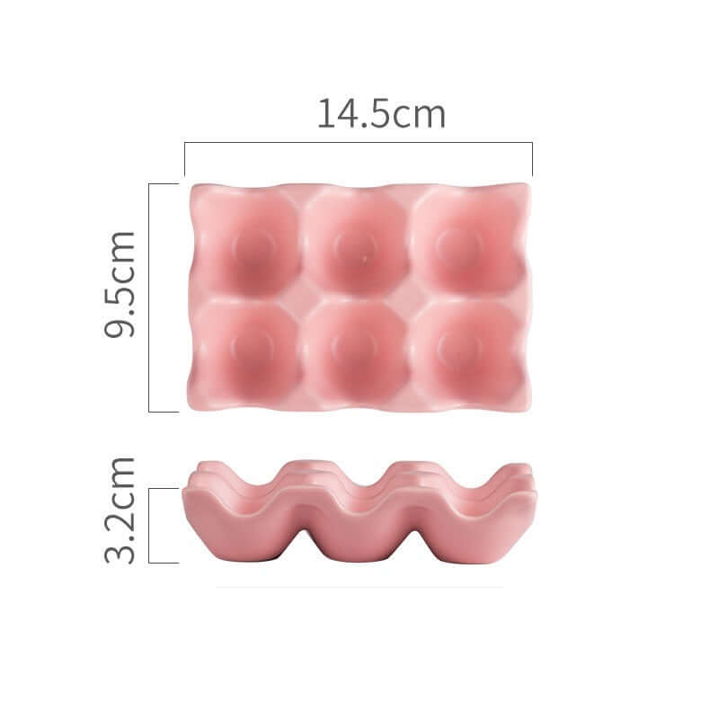 Pink plastic egg holder with 6 slots, dimensions labeled 14.5cm x 9.5cm x 3.2cm.