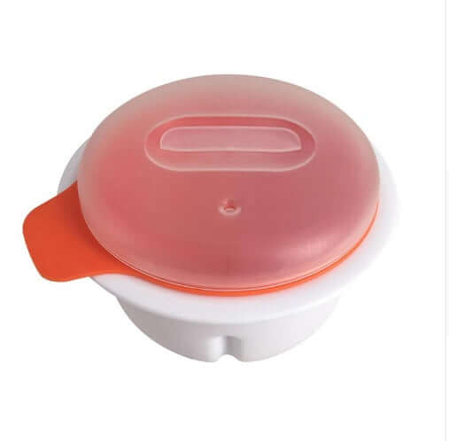 Plastic microwave egg cooker with orange handle and translucent lid on white background