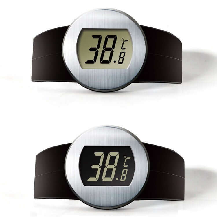 Digital kitchen thermometer with round silver display and black band, showing temperature reading.