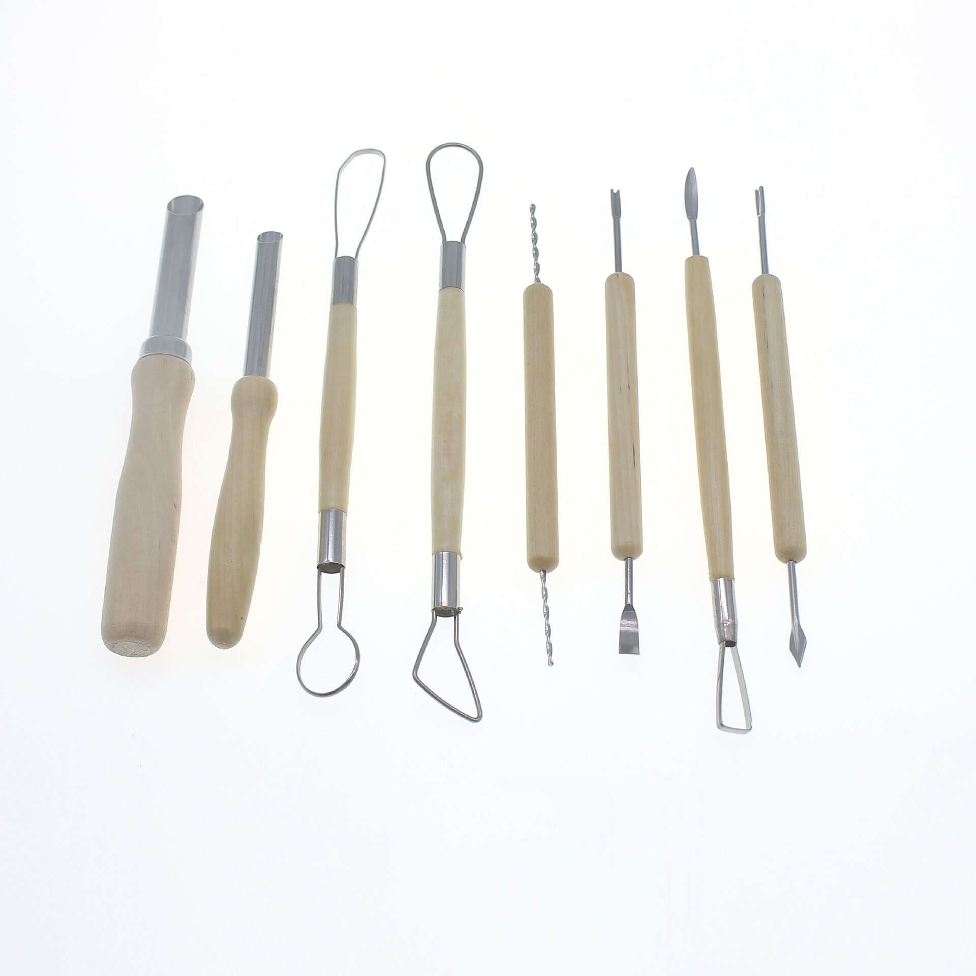 Set of wooden handle kitchen utensils and carving tools on white background
