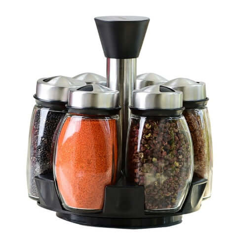 Rotating spice rack with stainless steel lids, filled glass jars, kitchen organizer