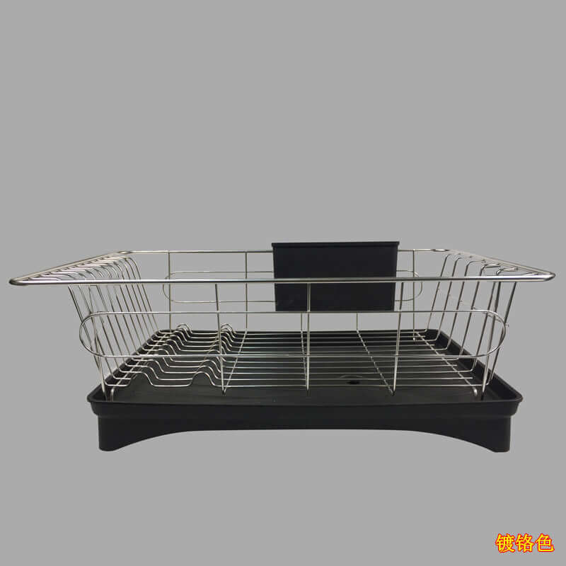 Stainless steel kitchen dish drying rack with black plastic drip tray on gray background