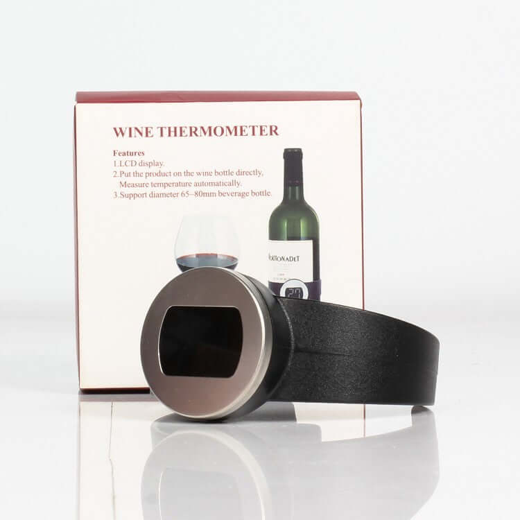 Digital wine bottle thermometer with LCD display, shown in front of product packaging